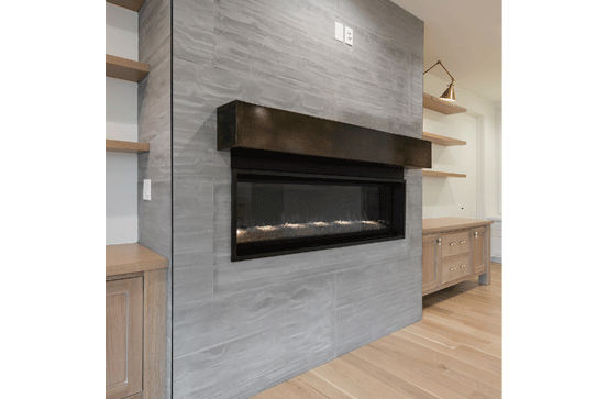 decorative concrete wall panels around interior fireplace